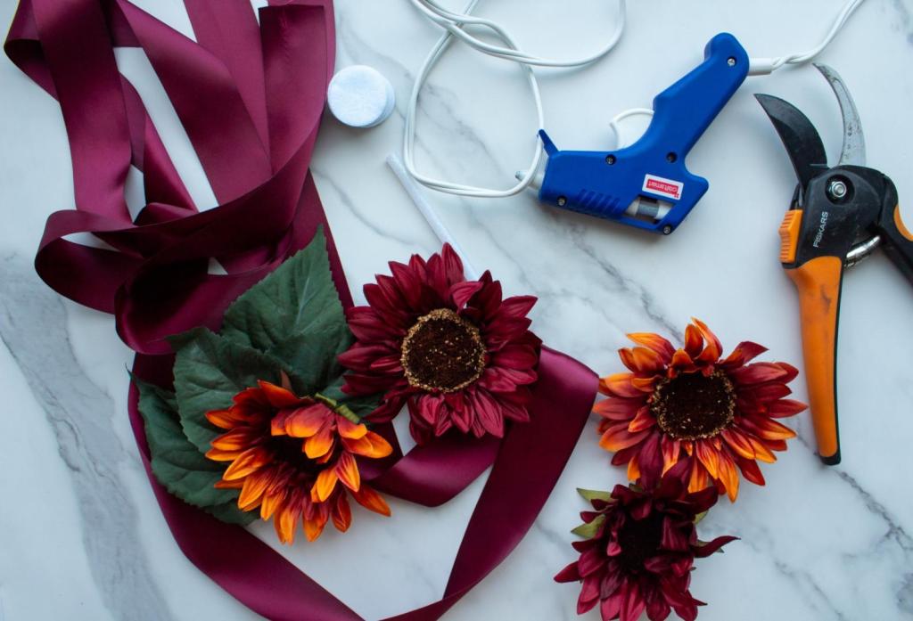 Varius supplies lay out to make a maternity sash belt for a Baby-Q baby shower.