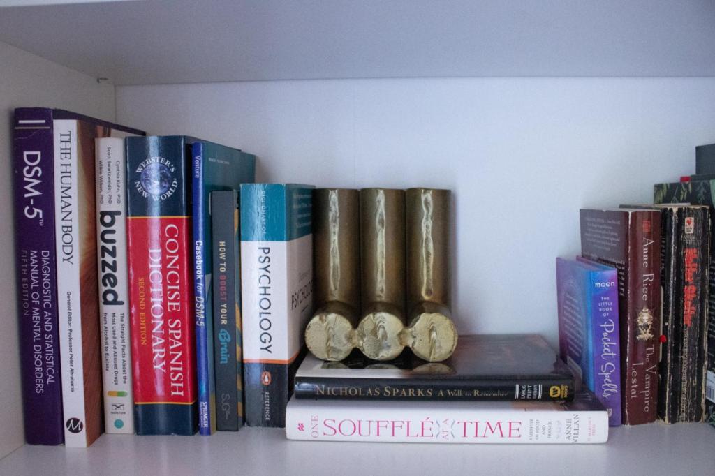 A bookend dons the shelf of academic and professional books.