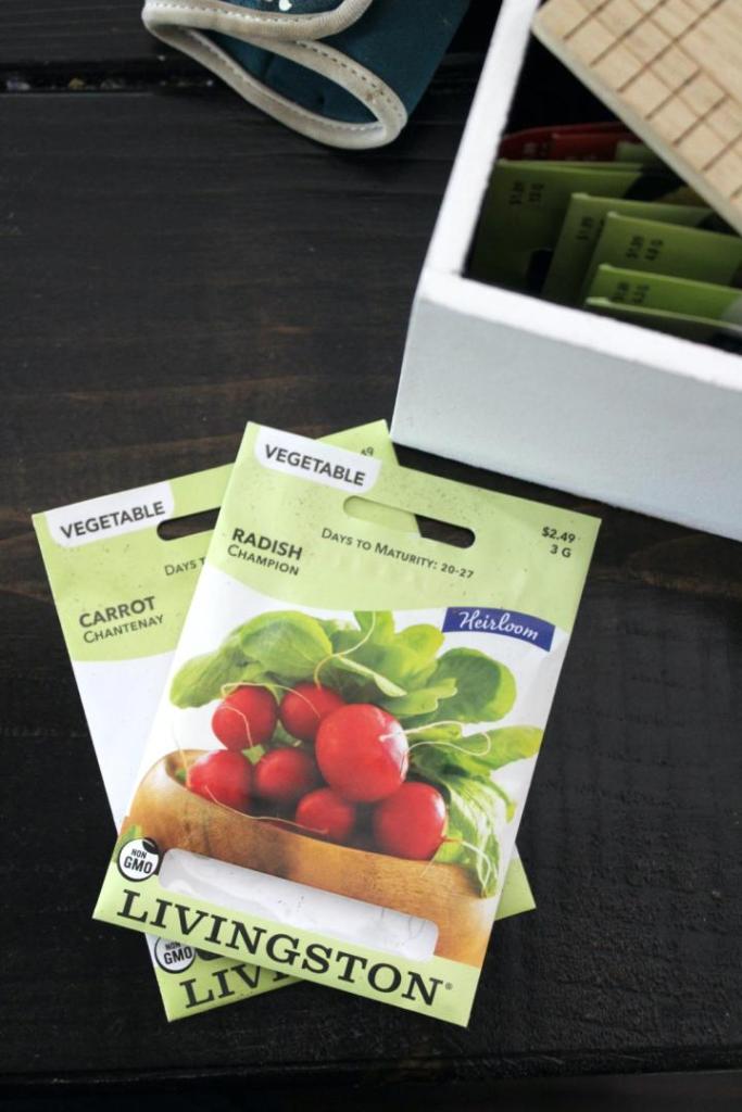 Vegetable seeds lay across a table.