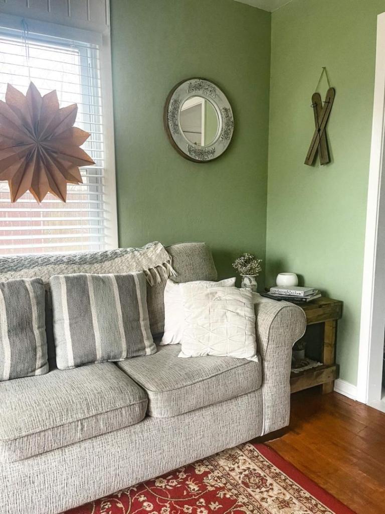 Cottagecore living room ideas are shown with some rustic tables situated in the corner of it.