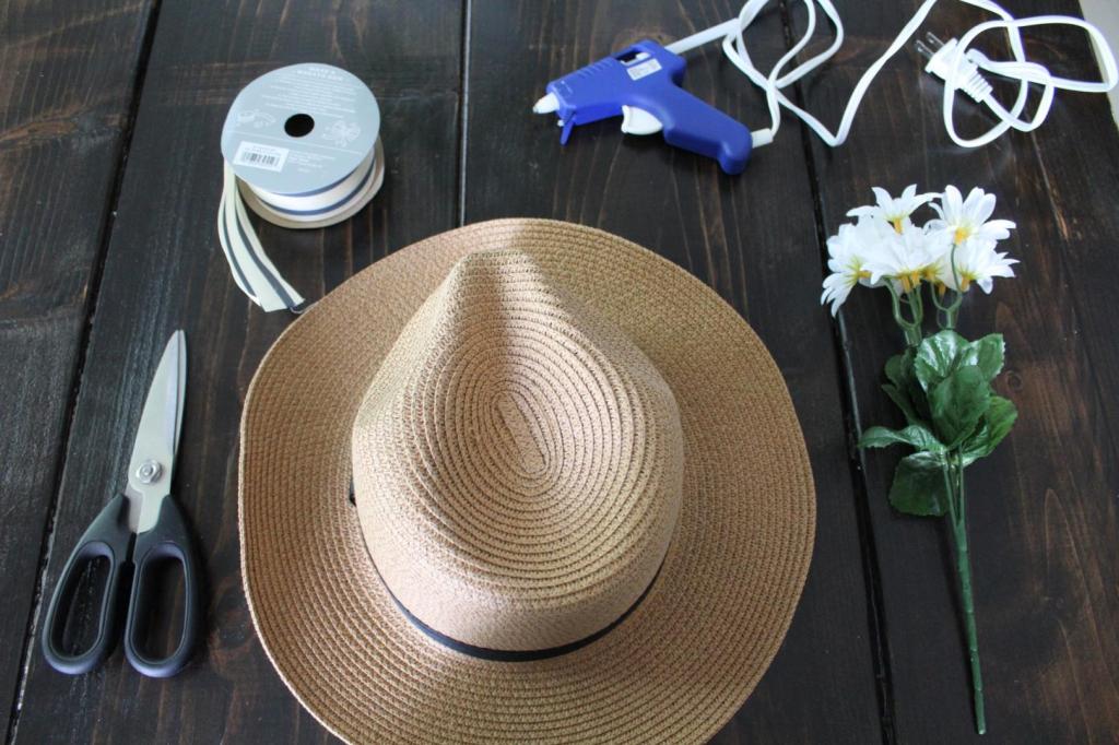 Supplies are scattered around a table for crafting.