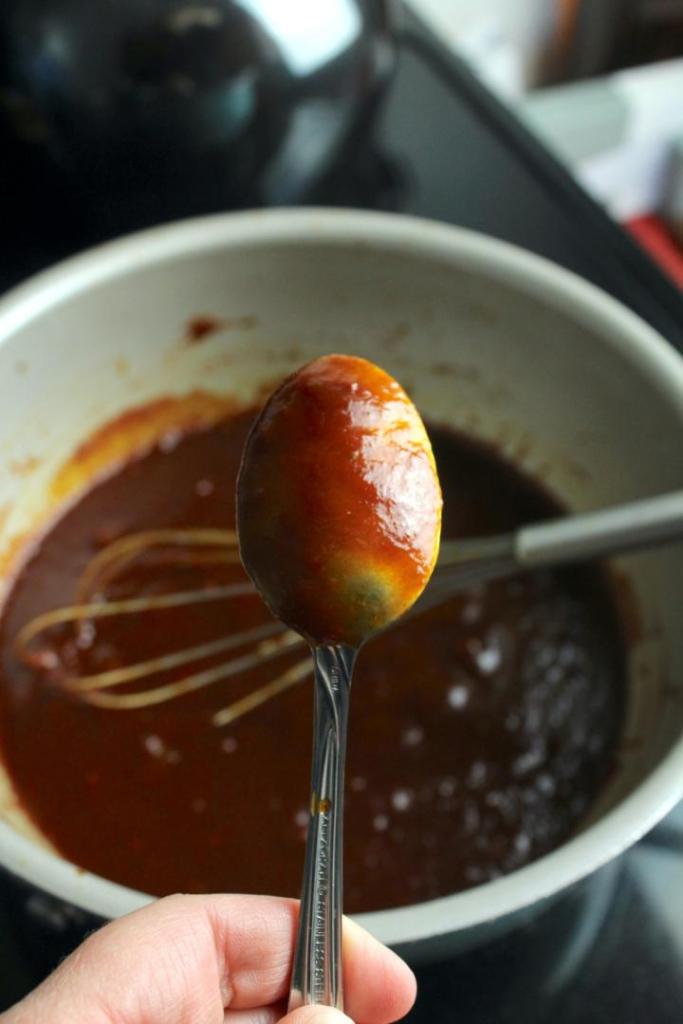 A finished bbq sauce has thicken in a pot after simmering.