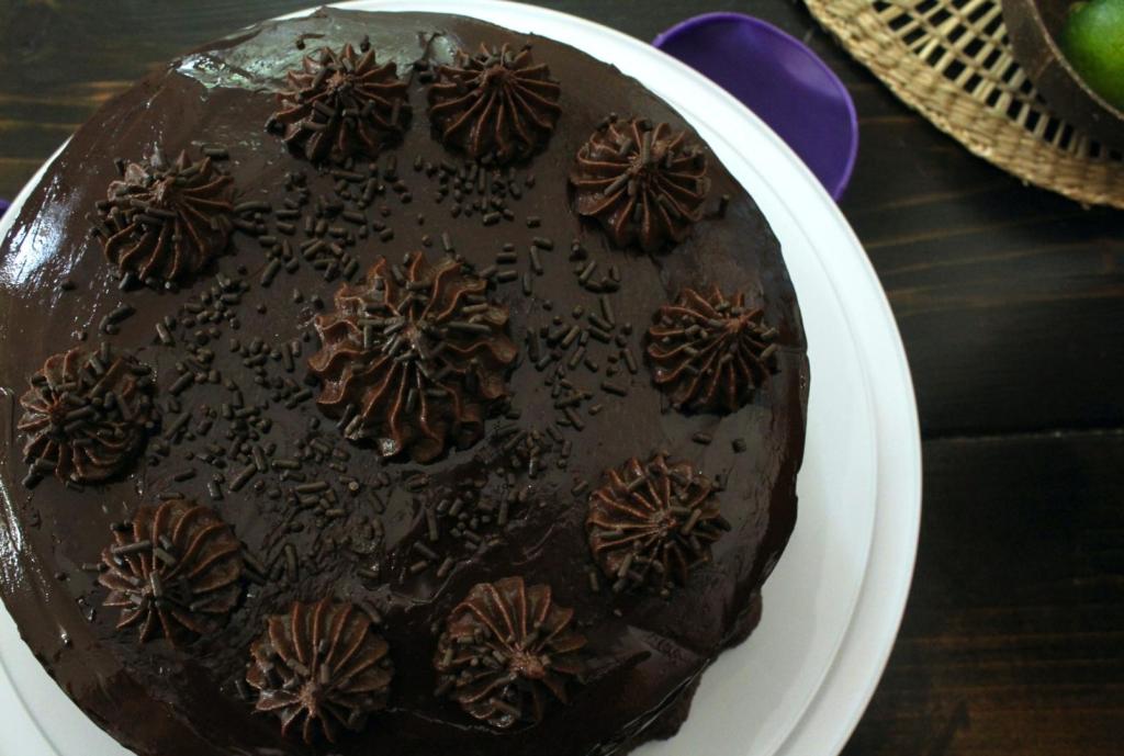 A chocolate layer cake is ready to be devoured.