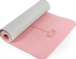 A pink yoga mat is rolled up.